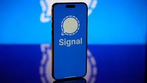 Smartphone displaying Signal app notification with blue background.